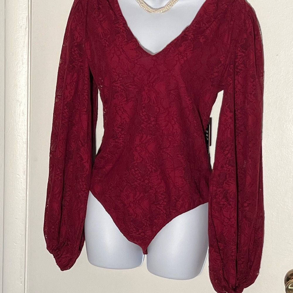 EXPRESS burgundy lace body suit with v-neck and puffed sleeves